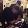 Bobby signing autographs